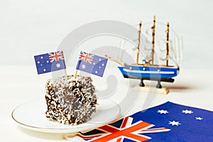 Iconic traditional Australian party food, Lamington cakes on a red, white and blue background