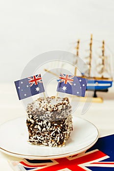 Iconic traditional Australian party food, Lamington cakes on a red, white and blue background