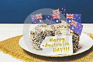 Iconic traditional Australian party food, Lamington cakes on a red, white and blue background.