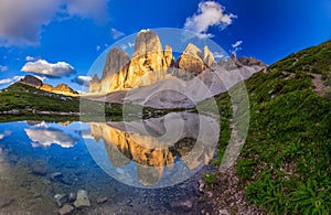 Iconic Tre Cime peaks from Tre Cime di Lavaredo Loop trail at sunset , Italy