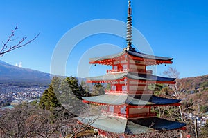 The iconic view of Mount Fuji with the red Chureito pagoda and Fujiyoshida city from Arakurayama sengen park in Yamanashi