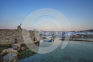 Iconic view from the picturesque old historical castle at the seaside village of Naousa in the island of Paros, Cyclades, Greece