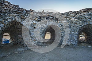 Iconic view from the picturesque old historical castle at the seaside village of Naousa in the island of Paros, Cyclades, Greece