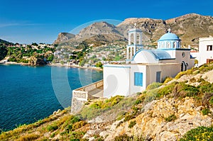 Iconic white church with blue domes, Greece