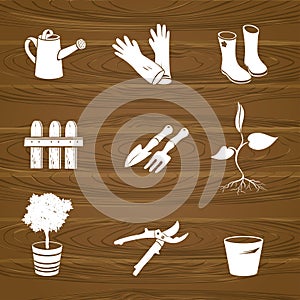 Icons garden tools on a wood background