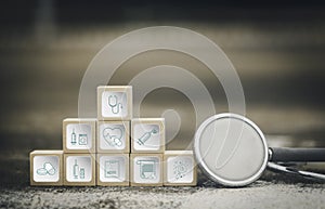 Icons healthcare medical symbol on wooden block.