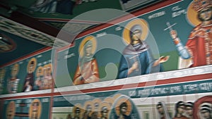 Icons of saints on the wall and the Prayer Altar in the Orthodox Church