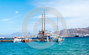 Icredible view of sailing yachts and boats and mountanious landscape of greece island photo