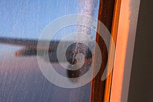 Icy airplane window in flight