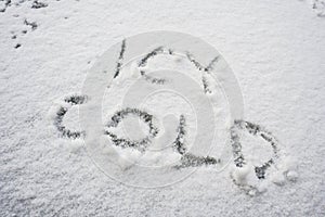 Icy cold written in white snow