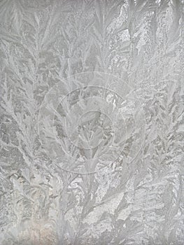 Icy frost patterns on the glass. Severe frost