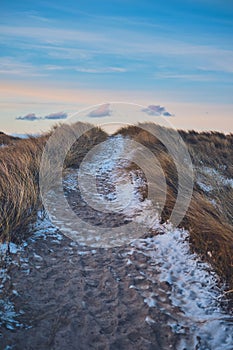icy path at the beach in winter in denmark