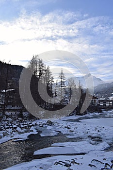 Icy river flowing through the Otztal Valley in Solden Alpine resort photo