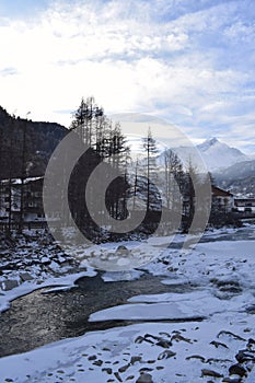 Icy river flowing through the Otztal Valley in Solden Alpine resort photo