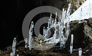 Icy stalagmites at Karani-koba cave in Crimea mountains, Ukraine