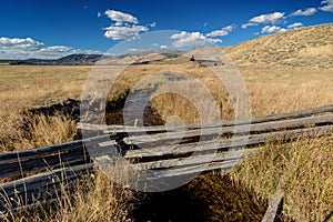 Idaho farm field with Log Cabin