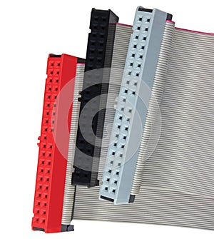 IDE connectors and ribbon cables for hard drive on PC computer, isolated, red, grey, black, large detailed macro closeup