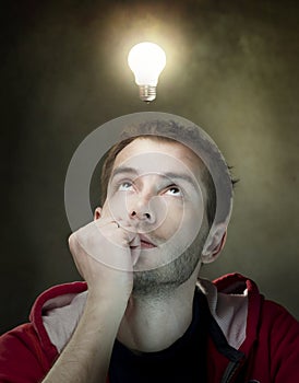 Idea bulb above mans head