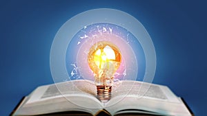Idea bulb light on open book. Education, study, knowledge concept.