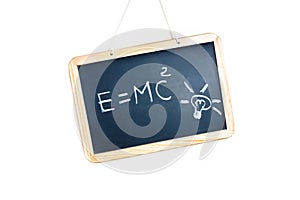 Idea concept with bulb light and energy formula on school blackboard