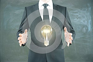 Idea concept man holding bulb