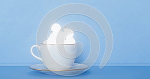 Idea and creativity concepts with hot coffee cup and light bulb on blue background