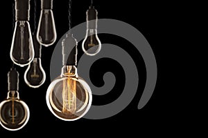 Idea and leadership concept Vintage incandescent Edison bulbs on