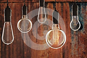 Idea and leadership concept Vintage incandescent Edison bulbs on