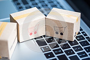 Stack boxes on laptop for Customer can buy from electronic internet.