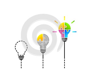 Idea, solution and innovation concept with light bulb made of puzzle