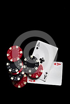 The idea of a winning combination in a poker game with one pair. Chips and cards on the black table in the poker club. Free ad