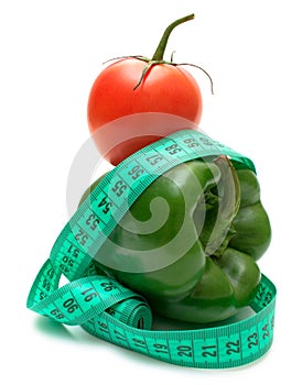 Ideal diet pair green bell pepper and tomato isolated on white