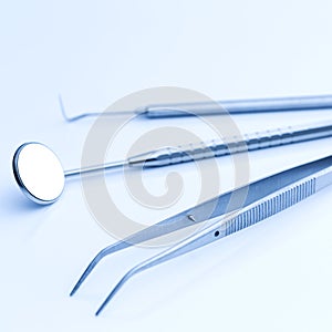 Dentist tools mirror, sonde, tweezers for dentistry odontology