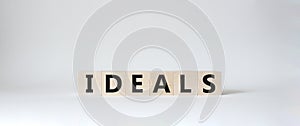 Ideals symbol. Wooden blocks with word Ideals. Beautiful white background. Business and Ideals concept. Copy space