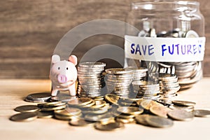 An ideas of saving money for the future with coins and piggy bank