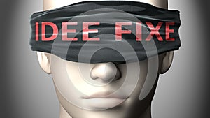 Idee fixe can make things harder to see or makes us blind to the reality - pictured as word Idee fixe on a blindfold to symbolize photo