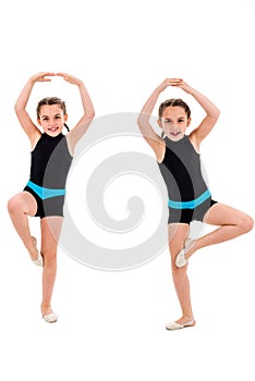 Identical twin girls practice and doing rhythmic gymnastics, white background