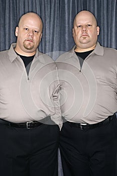 Identical twin men.