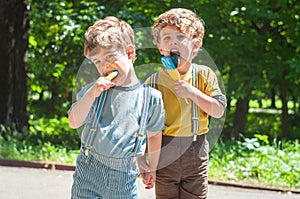 Identical twins eat lollies