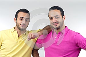Identical twins portraits shot isolated