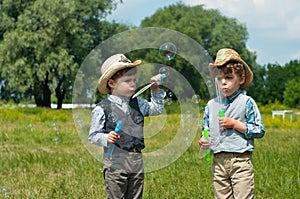 Identical twins with soap bubbles