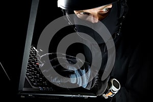 Identity theft with man working on laptop