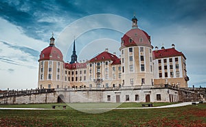 Idillic morning scene. Moritzburg Castle near Dresden with sky during of sunrise. Wonderful autumn sunrise in Saxony, Dresden,