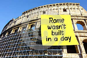 Idiom Rome wasn't built in a day postit Colosseum photo