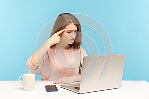 This is idiotic idea! Displeased woman having senseless silly talk on video call and showing stupid gesture to laptop screen