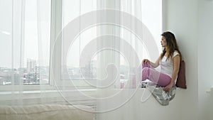 Idle leisure relaxed calm teen girl sitting window