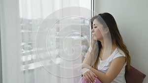 Idle leisure relaxed calm teen girl sitting window