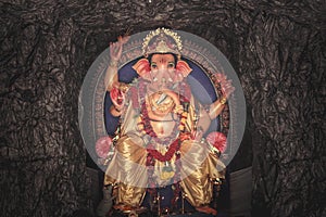 Idle of lord ganesha on cave background