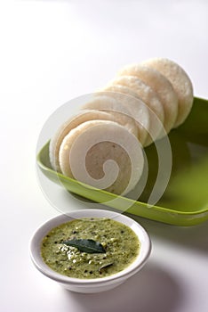 Idli with Sambar in bowl on white background, Indian Dish