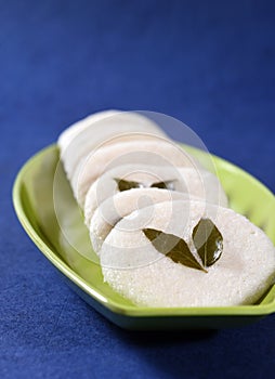 Idli with Sambar and coconut chutney on blue background, Indian Dish